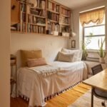 A daybed with white linens sits beneath a large wooden bookshelf in a bright room.